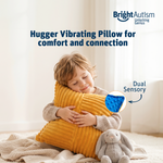 Boy hugging the Bright Autism Texturized Vibrating Pillow for comfort and sensory connection