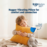 Boy hugging the Bright Autism Texturized Vibrating Pillow for comfort and sensory connection