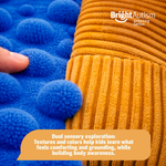 Close-up of the dual sensory textures on the Bright Autism Vibrating Pillow, corduroy and dotted fabric for body awareness